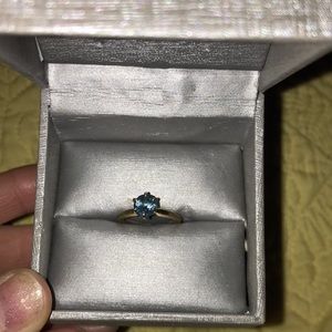 Turquoise 6 prong ring in yellow 14 karat gold.